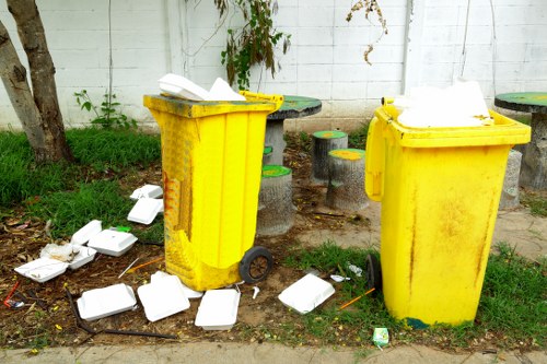 Recycling bins with various materials in Kilburn